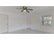 Bright main bedroom featuring neutral paint, a ceiling fan, and tile flooring throughout at 842 31St E Ave, Bradenton, FL 34208