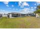 Large backyard with patio, shed, and privacy fence at 8718 Gaillard Ave, North Port, FL 34287