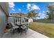Spacious backyard with patio dining set and shed at 8718 Gaillard Ave, North Port, FL 34287