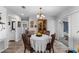 Bright dining room with wood floors, table, and built-in display cabinet at 8718 Gaillard Ave, North Port, FL 34287