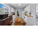 Bright kitchen with white cabinets, butcher block countertops, and modern appliances at 8718 Gaillard Ave, North Port, FL 34287