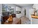 Functional kitchen with white cabinetry, butcher block countertops, and ample natural light at 8718 Gaillard Ave, North Port, FL 34287