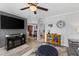 Inviting living room featuring stylish furnishings, a large TV, and modern decor at 8718 Gaillard Ave, North Port, FL 34287