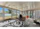 Sun room with model train set and large windows overlooking the backyard at 8718 Gaillard Ave, North Port, FL 34287