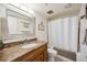 Bathroom with granite countertops and tub shower combo at 1650 1St W Ave # 503B, Bradenton, FL 34205