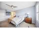 Bedroom with blue walls, ceiling fan, and natural light at 1650 1St W Ave # 503B, Bradenton, FL 34205