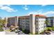 Exterior view of the condo building featuring multiple levels of residences and well-kept landscaping at 1650 1St W Ave # 503B, Bradenton, FL 34205