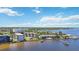 Aerial of condos, pool, and docks with river and bay views at 1650 1St W Ave # 503B, Bradenton, FL 34205