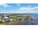 Aerial showcasing condos with a pool and dock overlooking the bay at 1650 1St W Ave # 503B, Bradenton, FL 34205