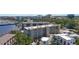 Exterior showcases a multi-story condominium with balconies and scenic views near a marina in an urban setting at 1650 1St W Ave # 503B, Bradenton, FL 34205