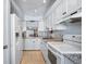 Clean kitchen featuring white cabinets and granite countertops at 1650 1St W Ave # 503B, Bradenton, FL 34205