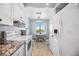 Bright eat-in kitchen with white appliances and sunny breakfast nook at 1650 1St W Ave # 503B, Bradenton, FL 34205