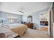 Bedroom with a ceiling fan and windows with white shutters at 1650 1St W Ave # 503B, Bradenton, FL 34205