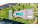Overhead shot of a uniquely shaped community pool and shuffleboard for condo residents at 1650 1St W Ave # 503B, Bradenton, FL 34205