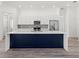 Modern kitchen featuring a large island, stainless steel appliances, and sleek cabinetry at Lot 20 Garafola Ave, North Port, FL 34291