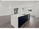 Modern kitchen featuring an island with sink, stainless steel appliances, and ample counter space at Lot 20 Garafola Ave, North Port, FL 34291