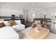 Bright living room with an open layout, connecting the kitchen, dining, and seating areas seamlessly at Lot 20 Garafola Ave, North Port, FL 34291
