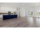 Bright living room with an open layout, connecting the kitchen, dining, and seating areas seamlessly at Lot 20 Garafola Ave, North Port, FL 34291