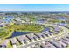 An expansive aerial view of a community showcases a network of ponds and residences at 10519 Spring Tide Way, Parrish, FL 34219