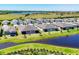 Aerial view of homes in a community with several ponds and manicured lawns at 10519 Spring Tide Way, Parrish, FL 34219