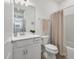 Clean, well-lit bathroom featuring modern fixtures and a shower-tub combo at 10519 Spring Tide Way, Parrish, FL 34219