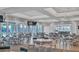 Spacious clubhouse with abundant seating, stylish chandeliers, and stunning water views at 10519 Spring Tide Way, Parrish, FL 34219