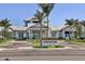 Exterior shot of the Driftwood Club features beautiful landscaping and elegant building design at 10519 Spring Tide Way, Parrish, FL 34219