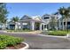 Exterior shot of the community building featuring lush landscaping and well-designed entrance at 10519 Spring Tide Way, Parrish, FL 34219