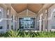Community center entrance with glass doors offering a glimpse of the pool area at 10519 Spring Tide Way, Parrish, FL 34219