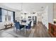 Bright kitchen featuring white cabinets, stainless steel appliances, and a large island with seating at 10519 Spring Tide Way, Parrish, FL 34219