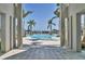 Stunning pool and fountain view framed by elegant architectural pillars, creating a serene retreat at 10519 Spring Tide Way, Parrish, FL 34219