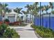 Scenic walking path surrounded by lush landscaping leads to community amenities at 10519 Spring Tide Way, Parrish, FL 34219