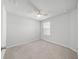 Bedroom with carpet flooring and a ceiling fan, offering a comfortable and relaxing space at 11828 Sky Acres Ter, Bradenton, FL 34211