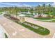 Community entrance with lush landscaping, a fountain lake, and decorative signage at 11828 Sky Acres Ter, Bradenton, FL 34211