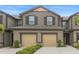 Charming two-story townhouse with attached two-car garage and well-manicured landscaping at 11828 Sky Acres Ter, Bradenton, FL 34211