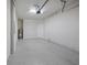 Spacious garage with sealed concrete floor and water heater at 11828 Sky Acres Ter, Bradenton, FL 34211