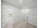 Upstairs hallway with carpet flooring leading to multiple rooms and a staircase at 11828 Sky Acres Ter, Bradenton, FL 34211