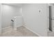 Upstairs hallway with carpet flooring, white trim and doors to multiple rooms at 11828 Sky Acres Ter, Bradenton, FL 34211