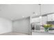 A large kitchen featuring an island, stainless steel appliances, and neutral countertops at 11828 Sky Acres Ter, Bradenton, FL 34211