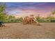 Colorful community playground with slides, swings, and play structures, perfect for Gathering fun and recreation at 11828 Sky Acres Ter, Bradenton, FL 34211