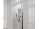 Stylish powder room featuring a pedestal sink, decorative mirror, and neutral color palette at 11828 Sky Acres Ter, Bradenton, FL 34211