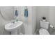 Close-up of powder room featuring a modern sink, faucet and a decorative mirror and plant at 11828 Sky Acres Ter, Bradenton, FL 34211