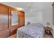 Well-lit bedroom featuring a ceiling fan, and ample storage space at 1212 41St Avenue E Dr, Ellenton, FL 34222