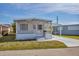 Charming single-story home with a screened in porch and a well-maintained lawn at 1212 41St Avenue E Dr, Ellenton, FL 34222