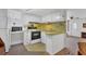 Functional kitchen with a compact layout and white cabinetry at 1212 41St Avenue E Dr, Ellenton, FL 34222