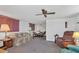 Inviting living room featuring neutral walls, carpeted flooring, and a ceiling fan at 1212 41St Avenue E Dr, Ellenton, FL 34222