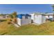 Exterior view of the convenient storage shed with access door on the property at 1212 41St Avenue E Dr, Ellenton, FL 34222