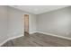 Well-lit room featuring wood-look tile flooring and neutral paint scheme at 12520 Brookgreen St, Venice, FL 34293