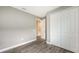 Inviting bedroom with closet, wood-look tile flooring, and neutral colors at 12520 Brookgreen St, Venice, FL 34293