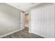 Bedroom featuring a closet with white doors and hardwood flooring at 12520 Brookgreen St, Venice, FL 34293